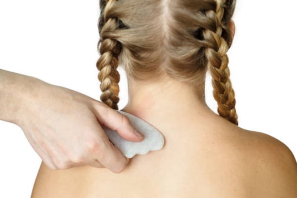 Gua sha tool used for gentle myofascial and connective tissue release